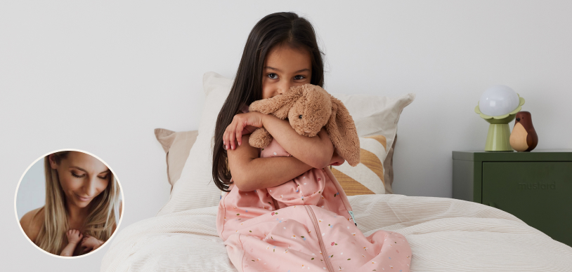 Preschooler wearing a pink sleeping bag